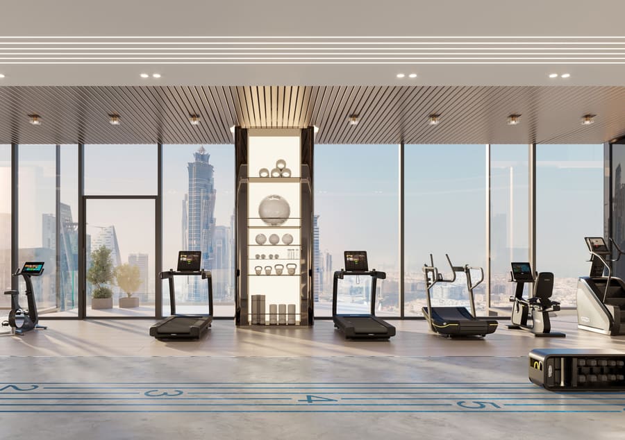 Artist's impression of the fitness studio with cardio equipment facing floor-to-ceiling skyline windows
